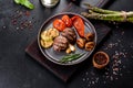 Tasty baked beef medallion with vegetables, mushrooms and spices Royalty Free Stock Photo