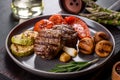 Tasty baked beef medallion with vegetables, mushrooms and spices Royalty Free Stock Photo