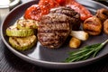 Tasty baked beef medallion with vegetables, mushrooms and spices Royalty Free Stock Photo