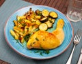 Tasty baked chicken potatoes and zucchini at plate Royalty Free Stock Photo