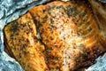 Tasty Baked Fish Salmon in Foil on Blue Table, Top View Royalty Free Stock Photo