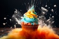 Tasty baking cupcake or muffin with cream icing, frosting, bright colored sprinkles. Rainbow Birthday cupcake with a sparkler and