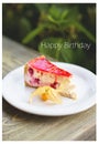 Tasty and beautiful cheesecake with strawberry jam-inscription happy birthday