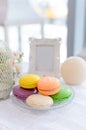 Tasty beautiful macaroons on a beautiful table in the style of P