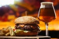 tasty beef burger with french fries and glass of beer Royalty Free Stock Photo