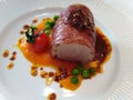 Tasty beef fillet wraped ÃÂ®n serano ham with carrot puree