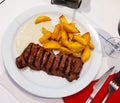 Tasty beef steak with baked potatoes and roquefort