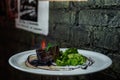 Tasty beefsteak in blue flame with baked broccoli in wine sauce. The original portion of steak in the restaurant. Healthy lunch.