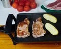 Tasty Beefsteak and Raw Caliu potatoes on a electric griddle