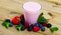 Tasty berry milk smoothie closeup