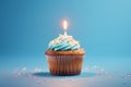 Tasty birthday cupcake with a candle on a blue background. Mini cake. Ai generative