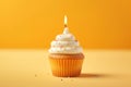 Tasty birthday cupcake with a candle on a yellow background. Mini cake. Ai generative