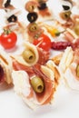 Tasty bites with prosciutto and olives