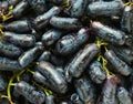 Tasty, black, ripe sweet sapphire grapes close up, background