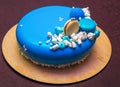 Tasty blue cake with a macarons