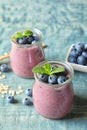 Tasty blueberry smoothie in jars and berries Royalty Free Stock Photo