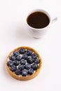Tasty blueberry tart with vanilla cream and cup of coffee Royalty Free Stock Photo