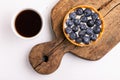 Tasty blueberry tart with vanilla cream and cup of coffee Royalty Free Stock Photo