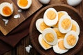 Tasty boiled chicken eggs on wooden table Royalty Free Stock Photo