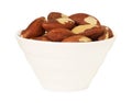 Tasty Brazil nuts in bowl isolated on white Royalty Free Stock Photo
