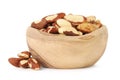 Tasty Brazil nuts in bowl isolated on white Royalty Free Stock Photo