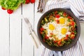 Tasty breakfast. Fried eggs with vegetables. Shakshuka. Royalty Free Stock Photo