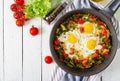 Tasty breakfast. Fried eggs with vegetables. Shakshuka. Royalty Free Stock Photo