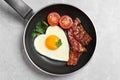 Tasty breakfast with heart shaped fried egg on table, top view Royalty Free Stock Photo