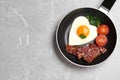 Tasty breakfast with heart shaped fried egg on table, top view. Space for text Royalty Free Stock Photo