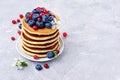 Tasty breakfast. Homemade pancakes with fresh cranberry, blueberry and spring flower