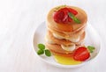 Tasty breakfast. Homemade pancakes with fresh strawberry and banana, honey and mint Royalty Free Stock Photo