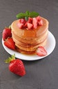 Tasty breakfast. Homemade pancakes with fresh strawberry, honey and mint Royalty Free Stock Photo