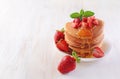 Tasty breakfast. Homemade pancakes with fresh strawberry, honey and mint Royalty Free Stock Photo