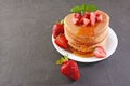 Tasty breakfast. Homemade pancakes with fresh strawberry, honey and mint Royalty Free Stock Photo