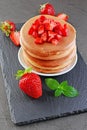 Tasty breakfast. Homemade pancakes with fresh strawberry and mint Royalty Free Stock Photo