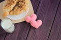 Tasty breakfast milk, croissants and felted hearts Royalty Free Stock Photo