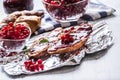 Tasty breakfast with red currants marmalade croissants butter an Royalty Free Stock Photo