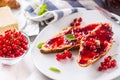 Tasty breakfast with red currants marmalade croissants butter an Royalty Free Stock Photo