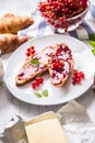 Tasty breakfast with red currants marmalade croissants butter an Royalty Free Stock Photo