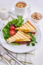 Tasty breakfast - sandwiches with fried eggs and bacon and fresh hot coffee Royalty Free Stock Photo