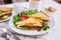 Tasty breakfast - sandwiches with fried eggs and bacon and fresh hot coffee Royalty Free Stock Photo