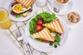 Tasty breakfast - sandwiches with fried eggs and bacon and fresh hot coffee Royalty Free Stock Photo