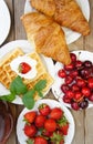 Tasty breakfast - tea, croissants, wafers and fruits Royalty Free Stock Photo