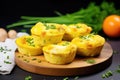 A tasty breakfast treat: muffin cups filled with eggs, bacon, and delicious cheese Royalty Free Stock Photo