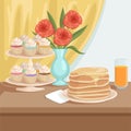 Tasty breakfast on wooden table. Plate with stack of pancakes, glass of fresh orange juice, stand with cupcakes, vase Royalty Free Stock Photo