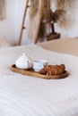 Tasty breakfast on wooden tray in bed in hotel Royalty Free Stock Photo