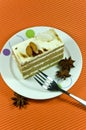 Tasty brown almond cake with white cream layers.