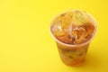 Tasty bubble tea in plastic cup on yellow background, closeup. Space for text Royalty Free Stock Photo