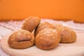 Tasty buns with sesame, on wooden background Royalty Free Stock Photo