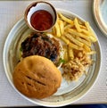 Tasty burger with fri potatos Royalty Free Stock Photo